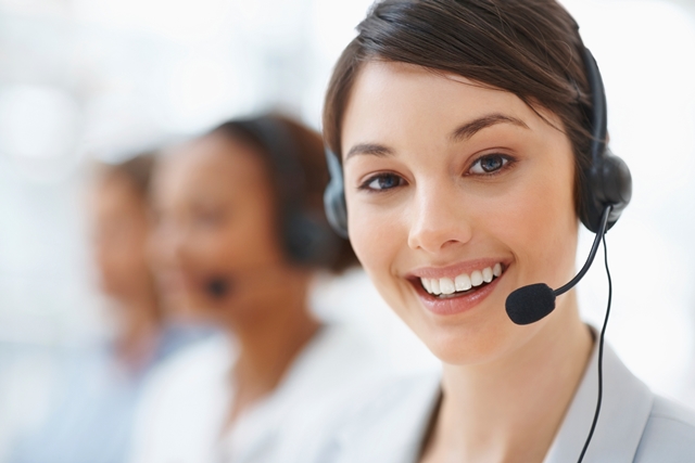 Closeup of a beautiful business customer service woman smiling